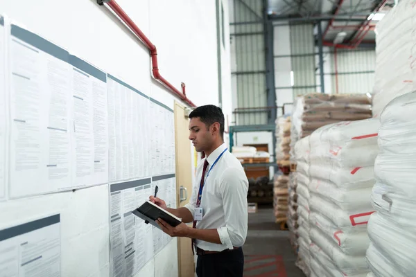 Side View Young Male Supervisor Writing Diary Warehouse — Stockfoto