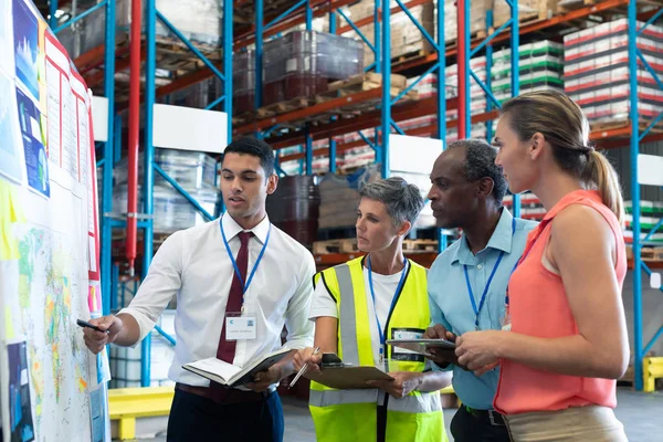Front View Diverse Warehouse Staffs Discussing Whiteboard Warehouse — Stock Photo, Image
