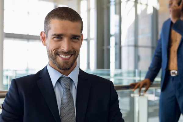 Close Portrait Young Caucasian Businessman Sitting Office Smiling Camera — Stock Photo, Image
