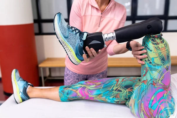 Mid Section Female Trainer Assisting Disabled Active Woman Stretching Leg — Stock Photo, Image