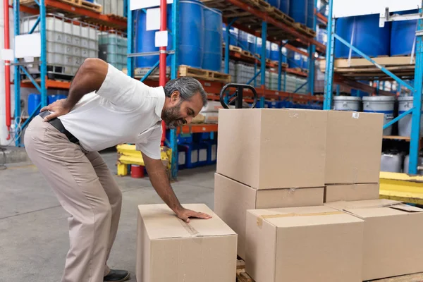 Male Staff Suffering Back Pain While Holding Heavy Cardboard Box — Stock Photo, Image