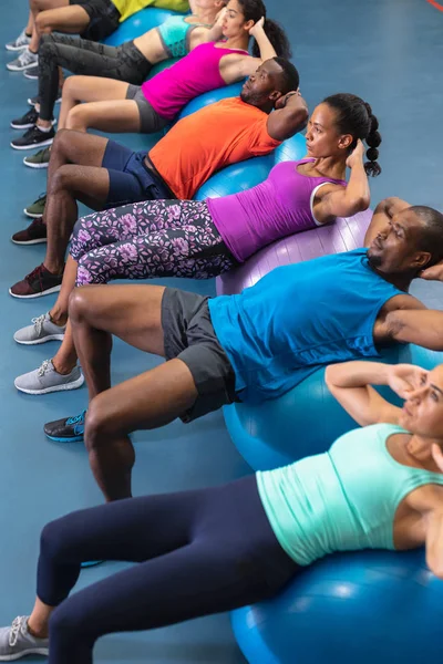 High Angle Diverse Fit People Exercising Exercise Ball Fitness Center — Stock Photo, Image