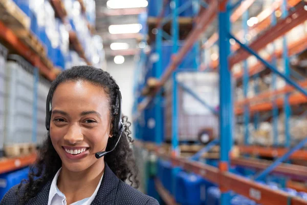 Close Happy Female Manager Talking Headset Warehouse — Stock Photo, Image