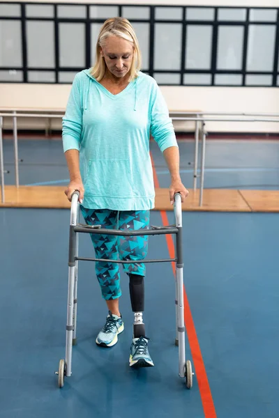 Front View Disabled Senior Woman Walking Walker Sports Center — ストック写真