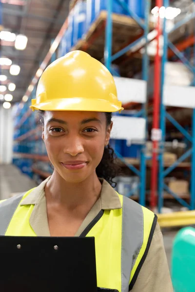 Close Female Staff Clipboard Looking Camera Warehouse — Stock Photo, Image