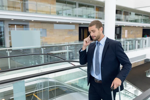 Front View Young Caucasian Businessman Suitcase Speaking Smartphone Reaches Top — Stock Photo, Image