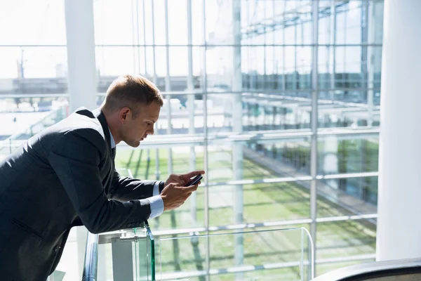 Businessman Using Mobile Phone Corridor Office — Stock Photo, Image