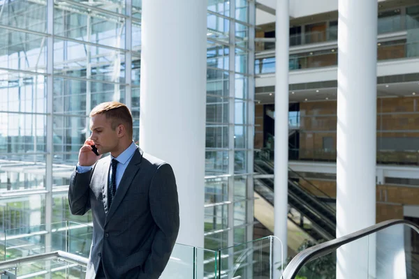 Businessman Talking Mobile Phone Corridor Office — Stock Photo, Image