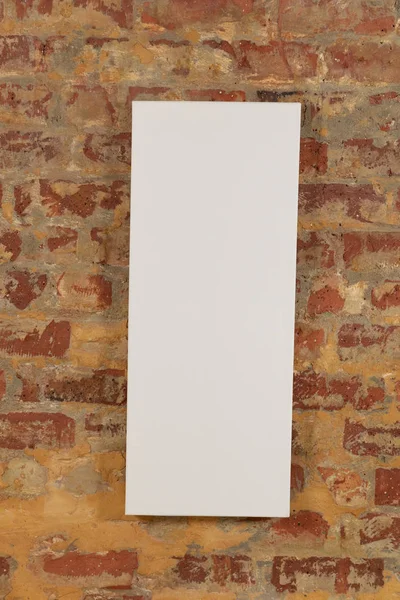 Tall Blank Canvas Hanging Brick Wall — Stock Photo, Image