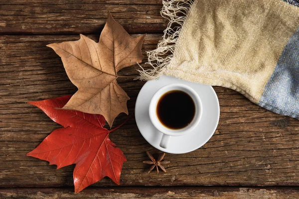 Autumn flat lay with coffee cup on wooden table