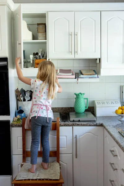 Rear View Young Caucasian Girl Her Kitchen Standing Chair Looking — Stock Photo, Image