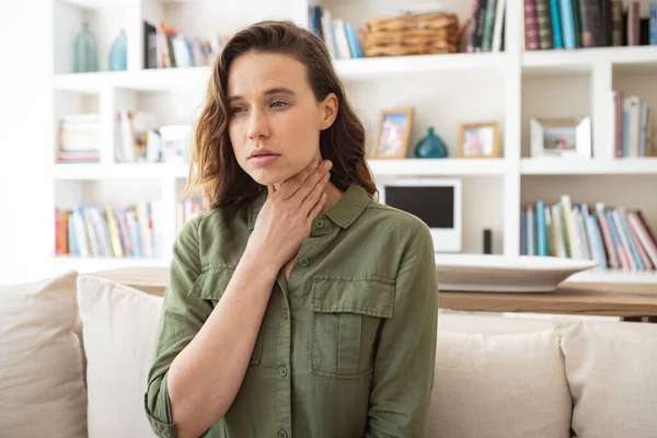 Caucasian Woman Spending Time Home Sitting Sofa Looking Sick Touching — Stock Photo, Image