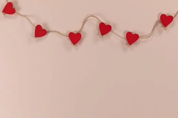 Close View Six Red Hearts Cut Paper Held Small Clothes — Stock Photo, Image