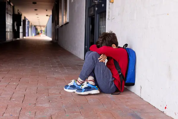 Biracial Boy Sits Alone School Head Resting Knees Looking Distressed — Stock Photo, Image