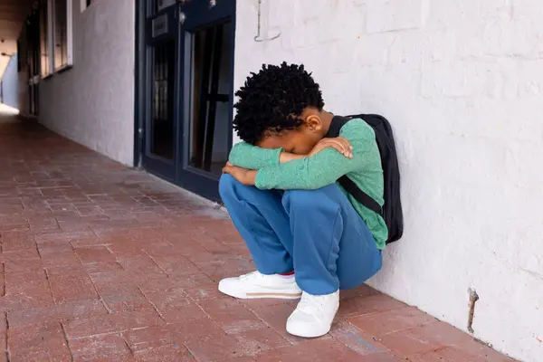 African American Boy Appears Upset Sitting Alone His Head Copy — Stock Photo, Image