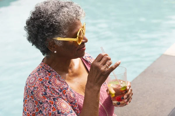 Senior Biracial Woman Enjoys Drink Pool Wearing Yellow Sunglasses Her — Stock Photo, Image