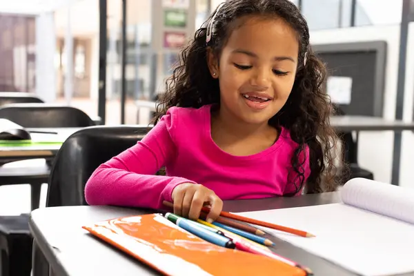 Biracial Girl Curly Hair Draws Colored Pencils School Classroom She — Stock Photo, Image