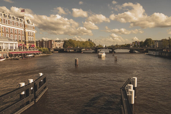 Amsterdam, Netherlands - August 3, 2013: A vintage color tone picture of Amsterdam, Amstel rever