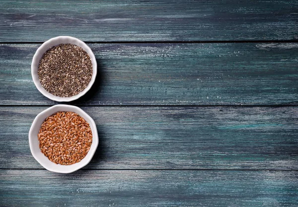 Chia seeds and flex seeds. Organic natural supplement omega-3, fatty acid content. Both seeds are rich in a variety of nutrients.Flat lay.Top view.