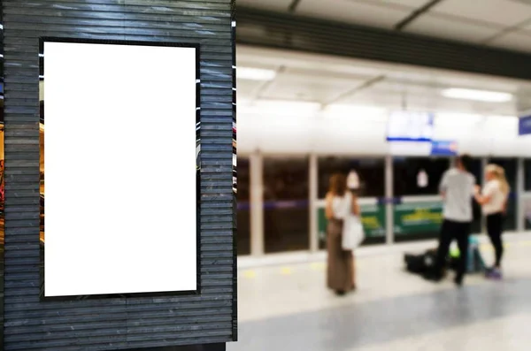 blank advertising billboard or showcase light box with copy space for your text message or media and content with people waiting subway at train station, commercial, marketing and advertising concept