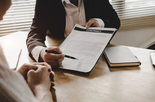 legal consultants, notary or justice lawyer discussing contract document and notebook on desk with client customer in courtroom office, business, justice law, insurance,  legal service concept