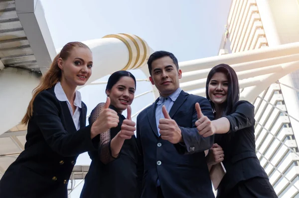 Partnership. diversity young business people team in suit showing thumbs up as like sign together in city, partnership, successful, support, meeting, partner, teamwork, community, connection concept