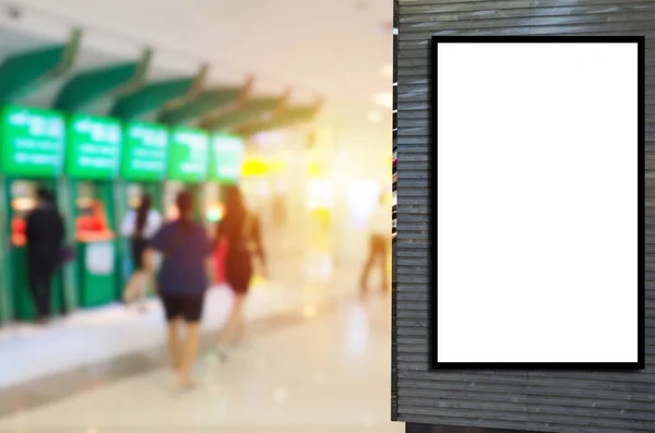 blank showcase billboard or advertising light box for your text message or media content with blurred view of people withdraw money from ATM in shopping mall, commercial, marketing, financial concept