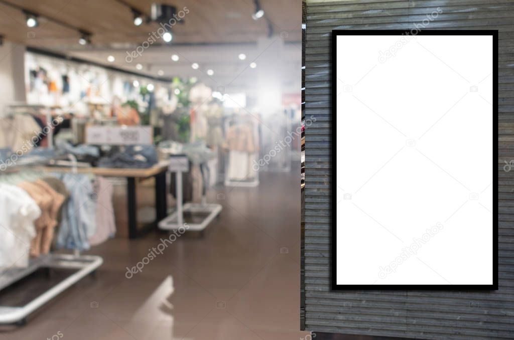 advertising light box or blank showcase billboard for your text message or media content with blurred image popular women fashion clothes shop showcase in shopping mall, commercial, marketing concept
