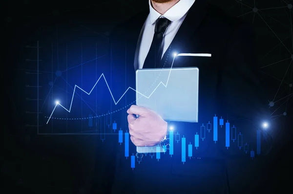 young handsome business man holding mobile smart tablet with effect global network link connection and graph chart of stock market graphic diagram, digital technology, internet communication concept