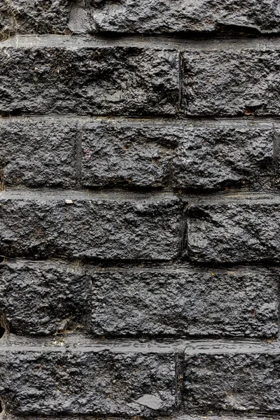 black brick wall or black painted old brick wall