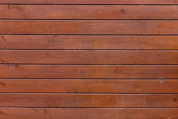 Wooden fence or wooden wall with glaze or oil tint or stain