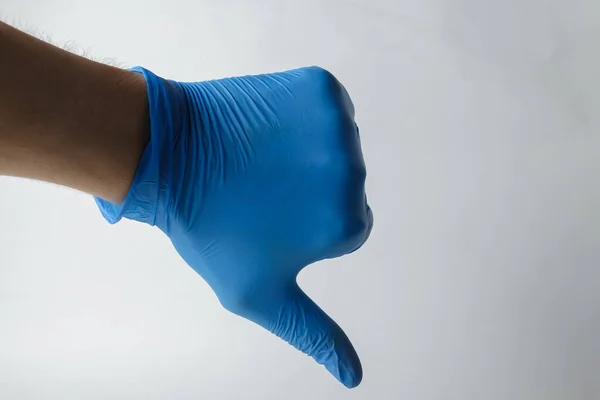 Tıbbi bir eldiven, jestler. Tıp veya kimya hakkında bir şeyler göstermek için uygun.