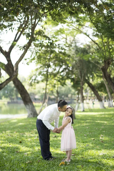 Asian father and daughter in the park