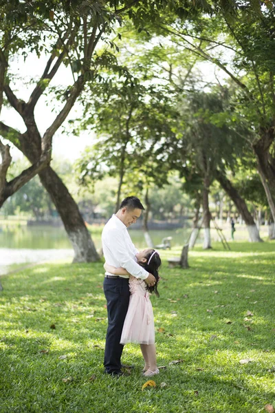 Asian father and daughter in the park