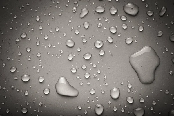 Wassertropfen Auf Einem Farbigen Hintergrund Grau Gemildert — Stockfoto