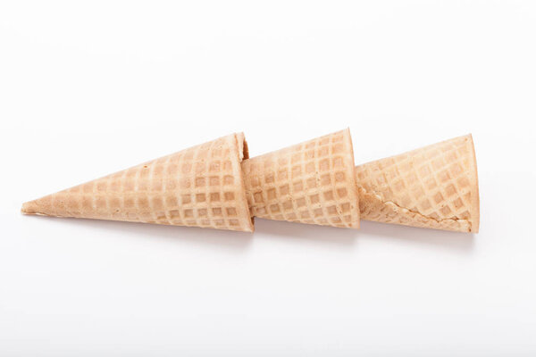 Empty sugar waffle cones for the ice cream isolated on white background.