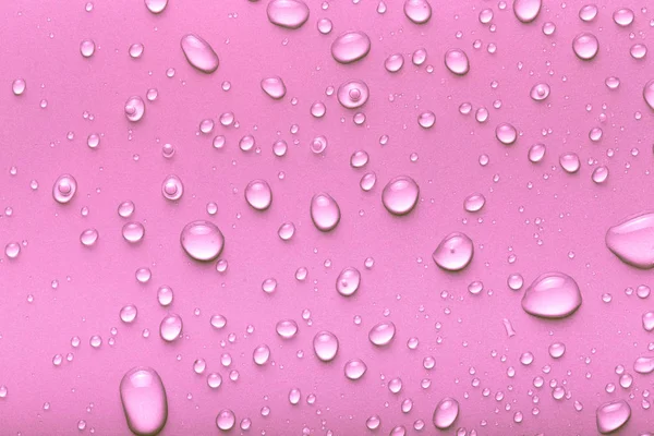 Gotas Agua Sobre Fondo Color Rosa Tonificado —  Fotos de Stock