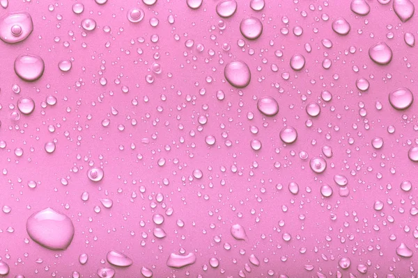 Gotas Agua Sobre Fondo Color Rosa Tonificado —  Fotos de Stock