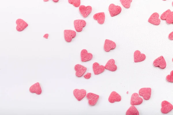 Mnoho Růžové Cukrové Srdce Jsou Roztroušeny Světlém Pozadí — Stock fotografie