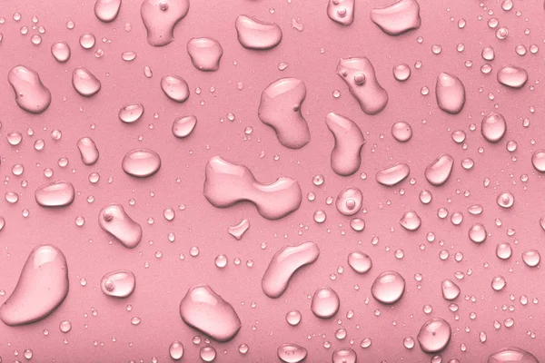 Gotas Agua Sobre Fondo Color Rosa Tonificado —  Fotos de Stock
