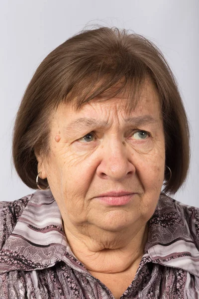 Portrait of an elderly dissatisfied woman — Stock Photo, Image