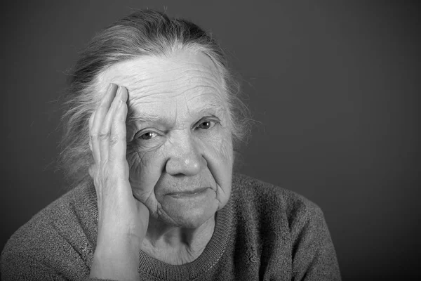 Portrait of elderly woman. Thoughtfulness. Toned — Stock Photo, Image