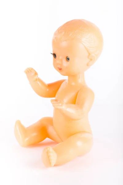 Old plastic doll on a light background — Stock Photo, Image