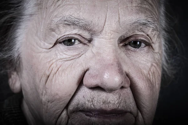 Portrait of elderly woman. Closeup view. Toned — Stock Photo, Image