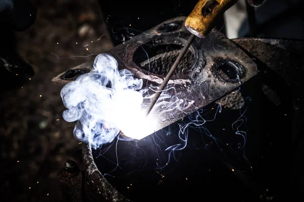 An experienced welder at work. Preparation and welding process o