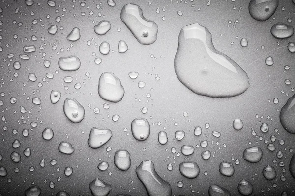 Drops of water on a color background. Dark grey. Toned — Stock Photo, Image