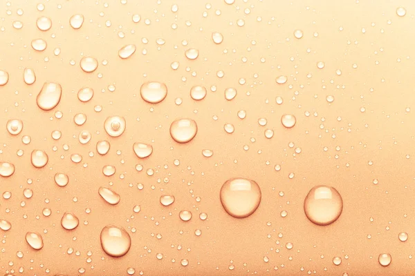 Gocce d'acqua su uno sfondo a colori. Arancione. Tonica — Foto Stock