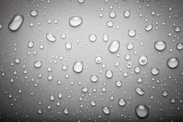 Drops of water on a color background. Dark grey. Toned — Stock Photo, Image
