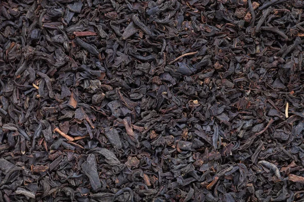Zwarte thee bladeren textuur close-up voor achtergrond — Stockfoto