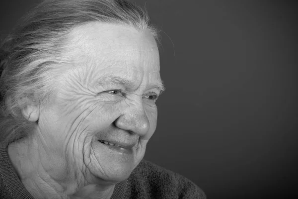 Portrait of elderly woman. Laugh. Toned — Stock Photo, Image